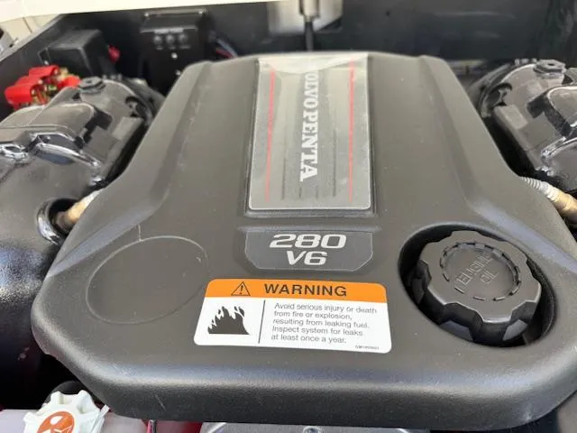 Slide: The Image of 2025 Regal LS2 engine, Volvo Penta 280 V6, with safety warning label. - 26