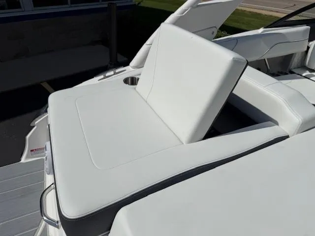 Slide: The Image of 2025 Regal LS2 boat with white leather seating and cup holder. - 27