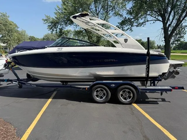 Slide: The Image of 2025 Regal LS2 boat on trailer in parking lot, side view. - 3