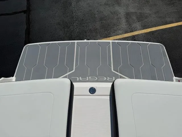 Slide: The Image of 2025 Regal LS2 boat swim platform with textured gray surface and white accents. - 31