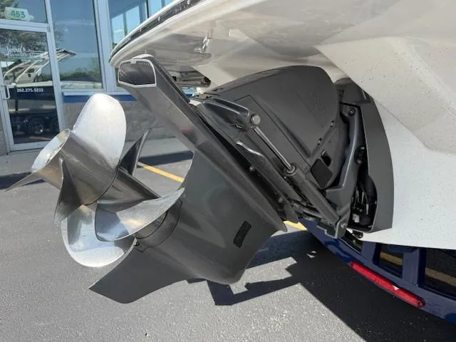 Slide: The Image of 2025 Regal LS2 boat propeller and stern drive in a showroom setting. - 33