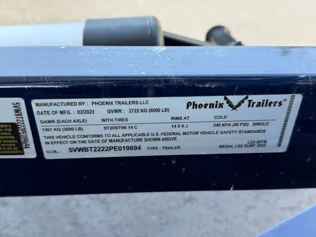 Slide: The Image of Label on Phoenix Trailers LLC, 2023, showing specifications and compliance details for Regal LS2 model. - 35