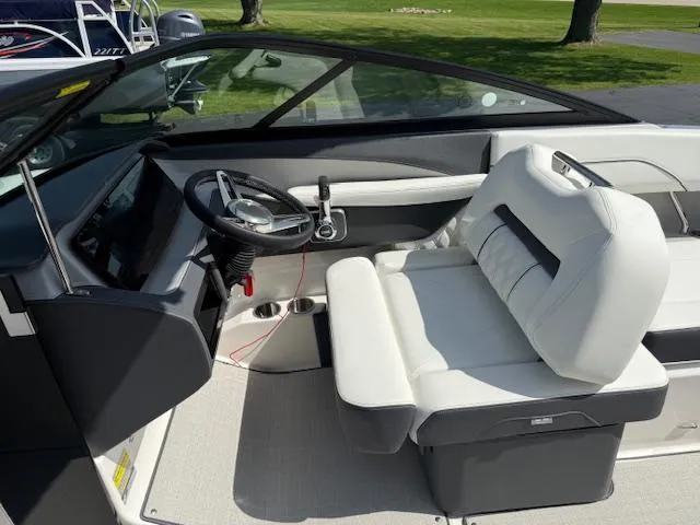 Slide: The Image of 2025 Regal LS2 boat interior with sleek steering and comfortable seating. - 6
