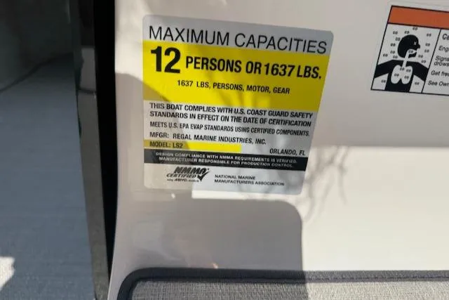 Slide: The Image of 2025 Regal LS2 capacity label: 12 persons or 1637 lbs, U.S. Coast Guard compliant. - 9