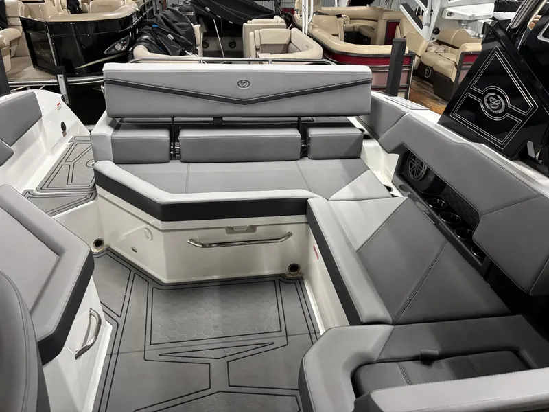 Slide: The Image of 2023 Cobalt R4 Surf boat interior with sleek gray seating and modern design. - 14