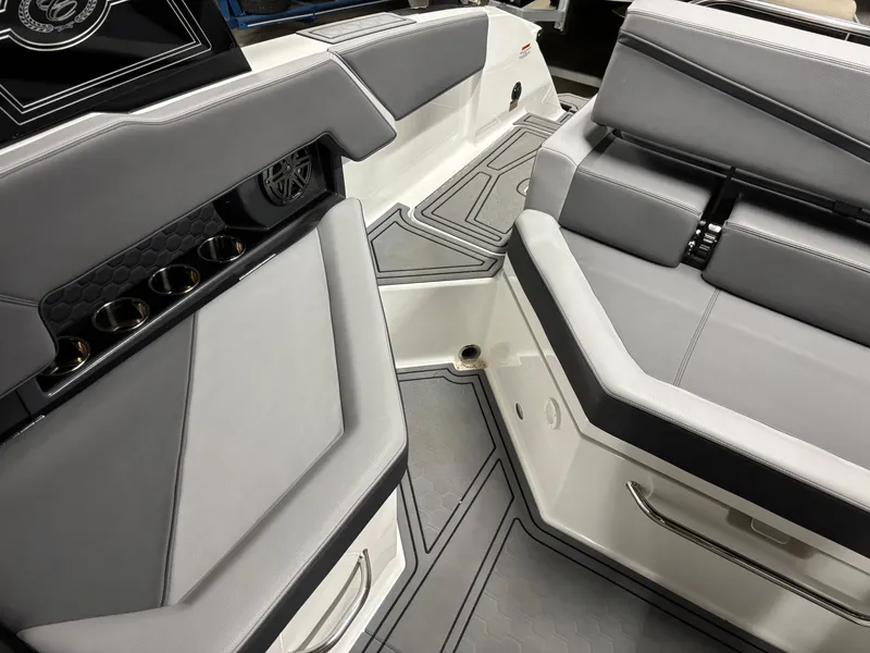 Slide: The Image of 2023 Cobalt R4 Surf boat interior with sleek gray seating and cup holders. - 17