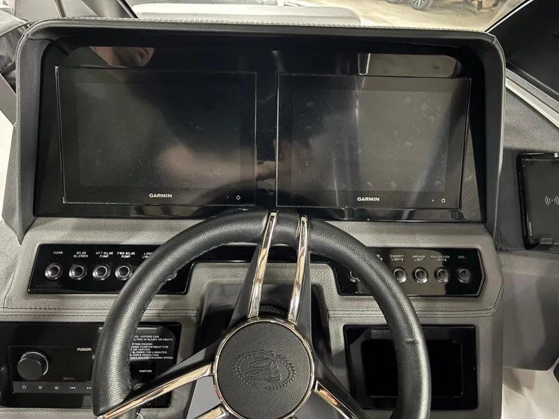 Slide: The Image of 2023 Cobalt R4 Surf dashboard with dual Garmin displays and steering wheel. - 20