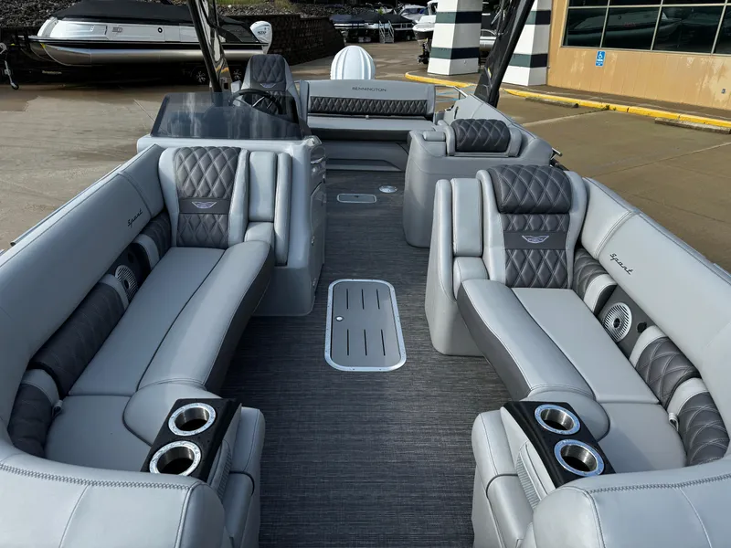 Slide: The Image of 2024 Bennington 25 QXSBA pontoon boat with luxurious gray seating and modern design. - 13