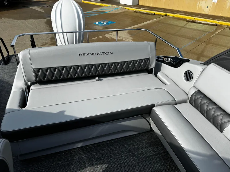 Slide: The Image of 2024 Bennington 25 QXSBA boat interior with luxurious seating and elegant design. - 20