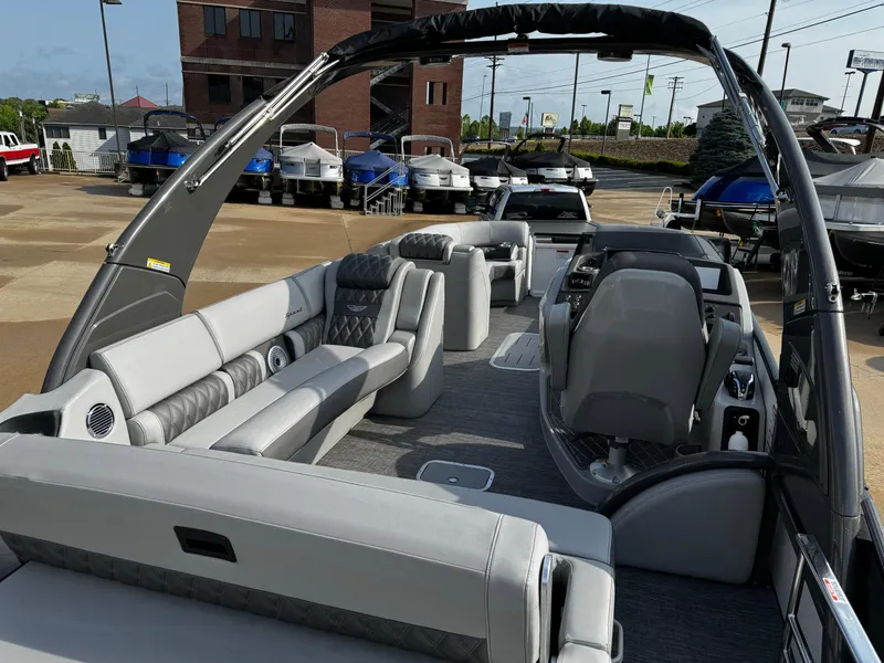 Slide: The Image of 2024 Bennington 25 QXSBA pontoon boat with luxurious seating and modern design. - 22
