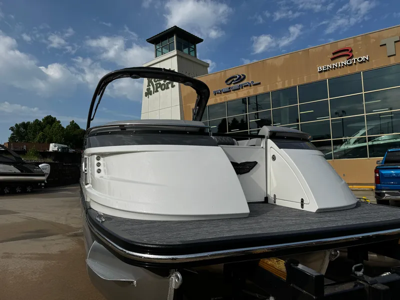 Slide: The Image of 2024 Bennington 25 QXSBA boat at dealership, showcasing sleek design and modern features. - 3