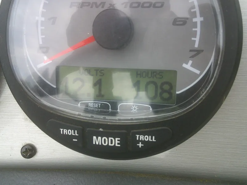 Slide: The Image of Close-up of a 2007 Lund 1900 Pro-V SE boat tachometer displaying 21 volts and 108 hours. - 11