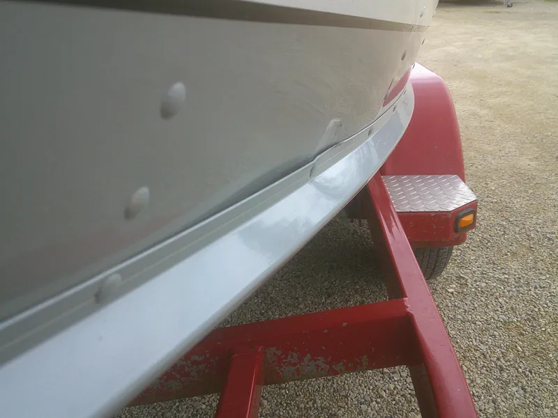 Slide: The Image of 2007 Lund 1900 Pro-V SE boat on red trailer, close-up view. - 4