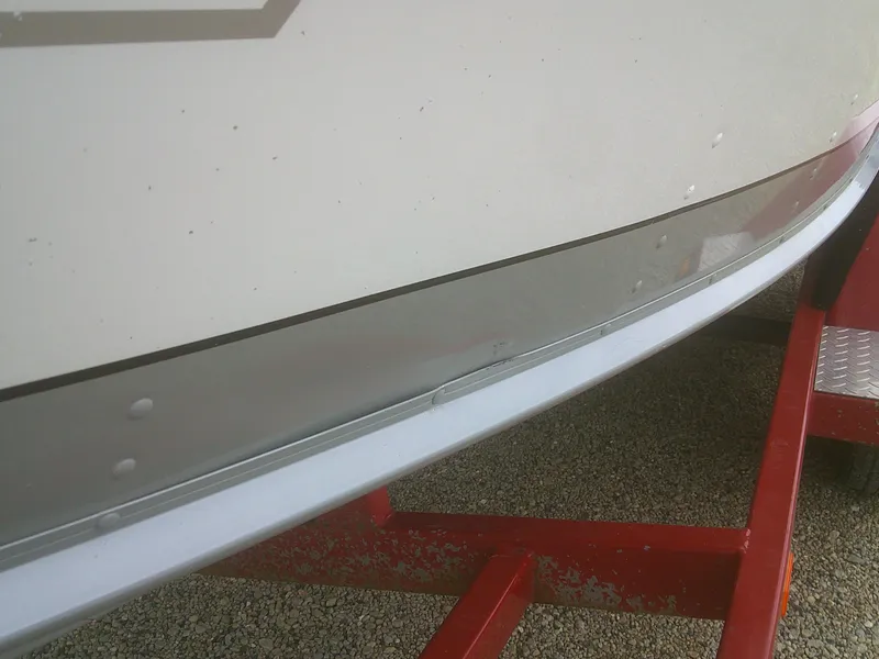 Slide: The Image of 2007 Lund 1900 Pro-V SE boat on red trailer, close-up view. - 5