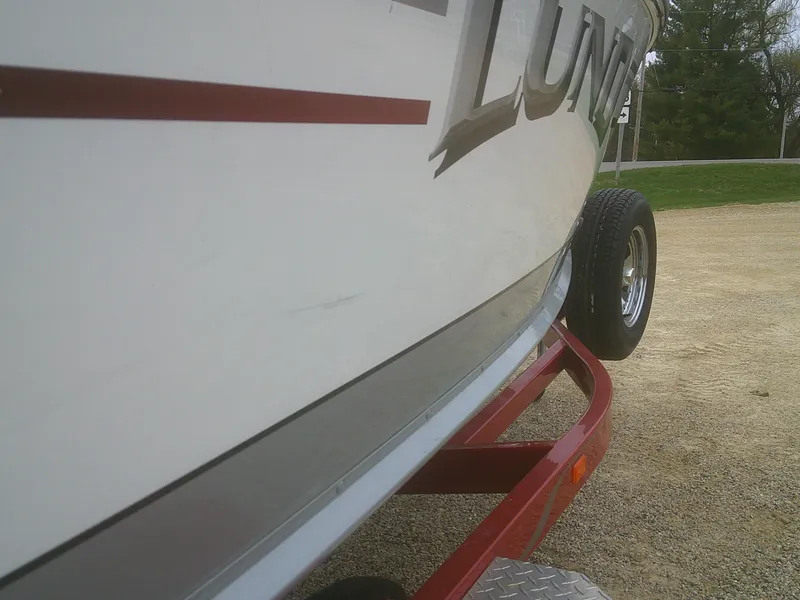 Slide: The Image of 2007 Lund 1900 Pro-V SE boat on a red trailer, side view. - 8