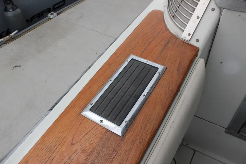 Slide: The Image of 1985 Trojan 10m Fly boat deck with wood and metal detailing. - 13