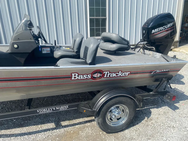 Slide: The Image of 2019 Bass Tracker Classic boat with Mercury engine on trailer, parked outdoors. - 4