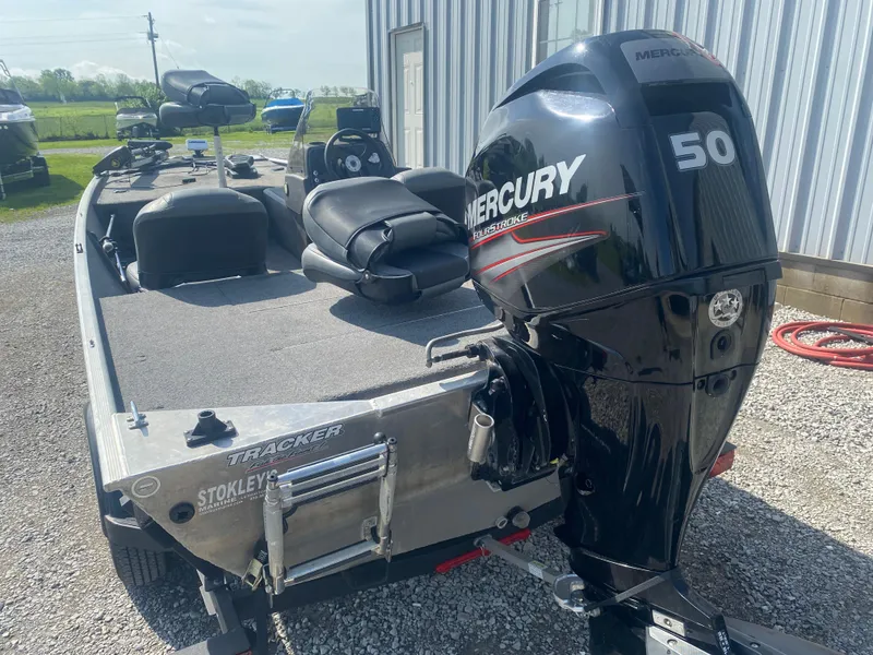 Slide: The Image of 2019 Bass Tracker Classic boat with Mercury 50 HP engine, parked outdoors. - 5