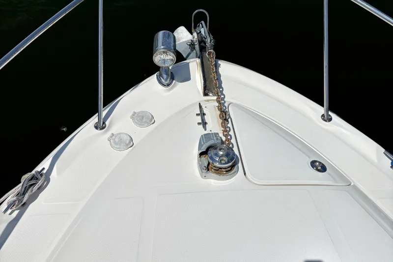 Slide: The Image of 2003 Sea Ray 340 Sundancer bow with anchor chain and deck details. - 12