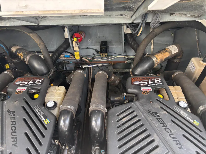 Slide: The Image of Engine compartment of a 2003 Sea Ray 340 Sundancer with Mercury 5.7L engines. - 13