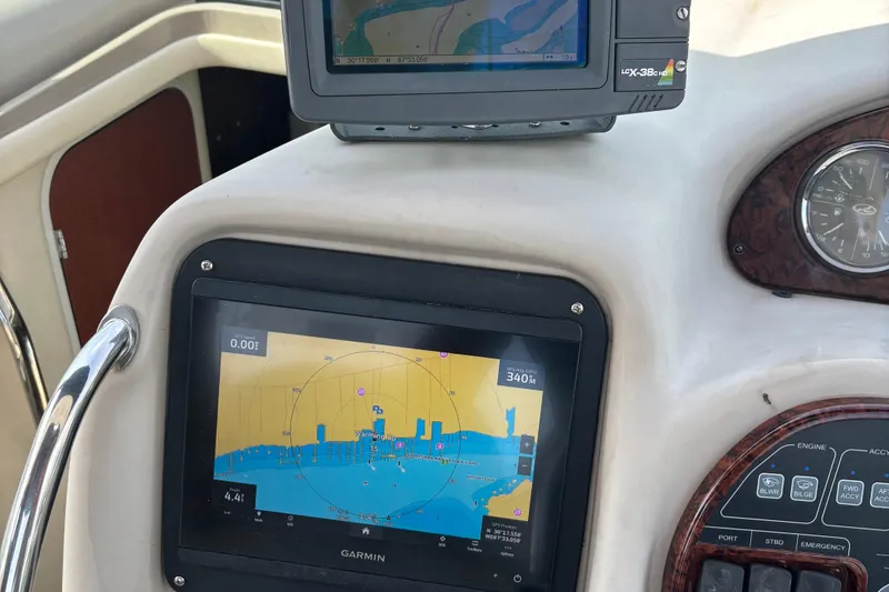 Slide: The Image of Dashboard of a 2003 Sea Ray 340 Sundancer with Garmin navigation display. - 14