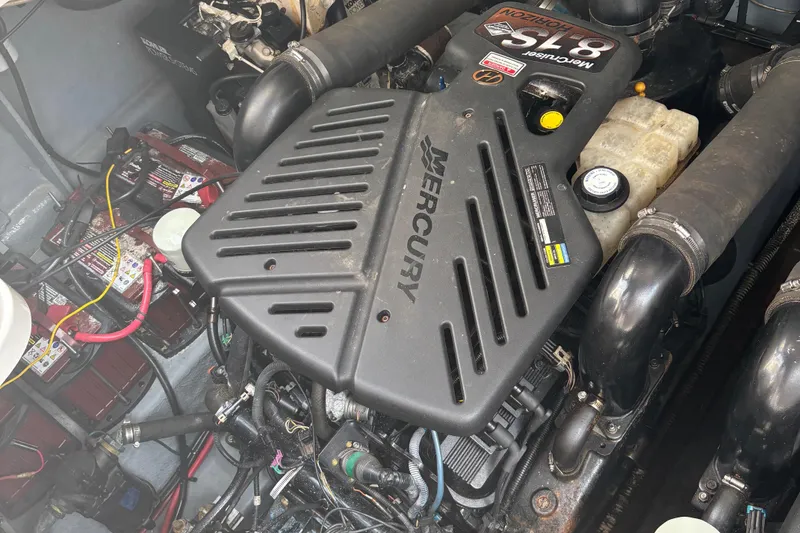 Slide: The Image of Engine compartment of a 2003 Sea Ray 340 Sundancer with Mercury components. - 15