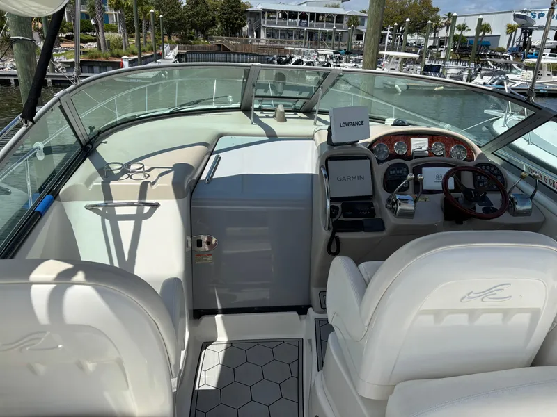 Slide: The Image of 2003 Sea Ray 340 Sundancer cockpit with modern navigation equipment and comfortable seating. - 3