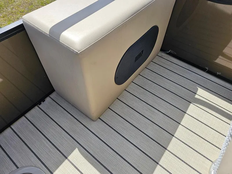 Slide: The Image of 2024 SunCatcher Elite 326 SE boat interior with cushioned seating and striped flooring. - 15