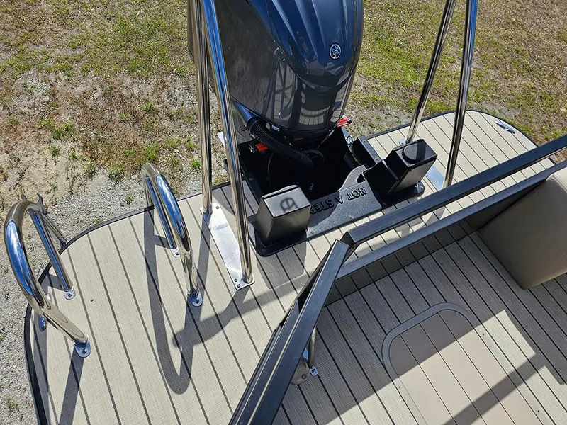 Slide: The Image of 2024 SunCatcher Elite 326 SE boat deck with motor and stainless steel railings. - 16
