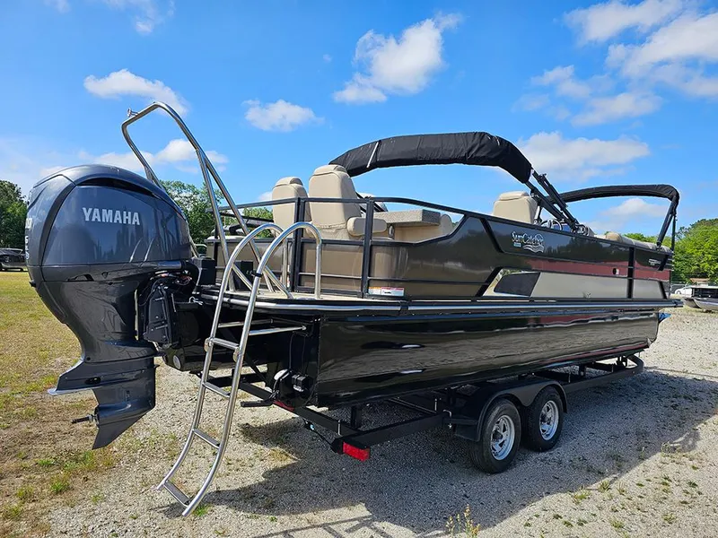 Slide: The Image of 2024 SunCatcher Elite 326 SE pontoon boat with Yamaha engine on trailer. - 3