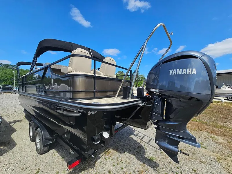 Slide: The Image of 2024 SunCatcher Elite 326 SE pontoon boat with Yamaha engine, parked outdoors. - 6