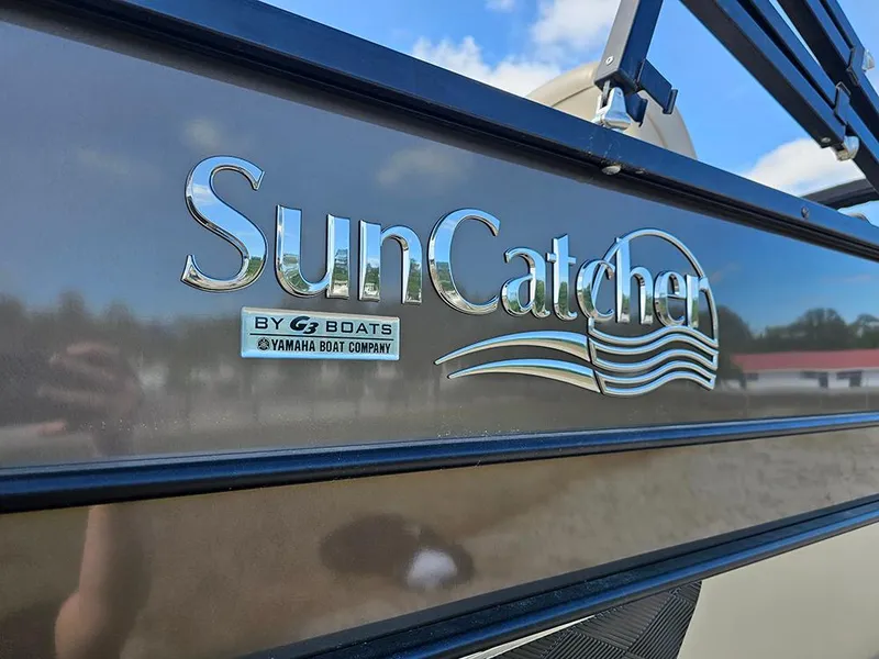 Slide: The Image of 2024 SunCatcher Elite 326 SE boat logo with Yamaha branding, outdoors under blue sky. - 8