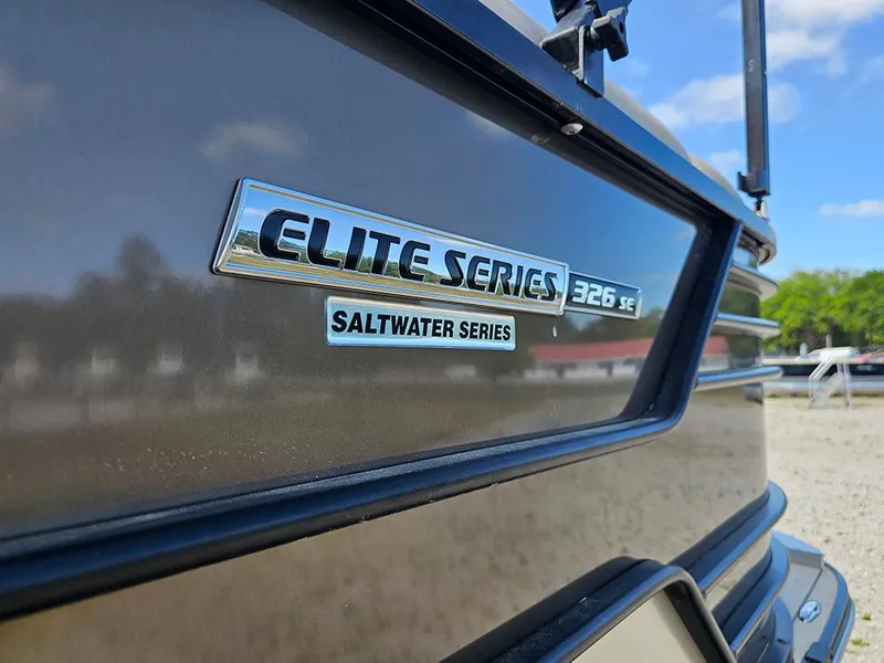 Slide: The Image of 2024 SunCatcher Elite 326 SE boat, Saltwater Series emblem, close-up view. - 9