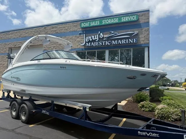 Slide: The Image of 2025 Regal LS6 Surf boat on trailer at Jerry's Majestic Marine dealership. - 0