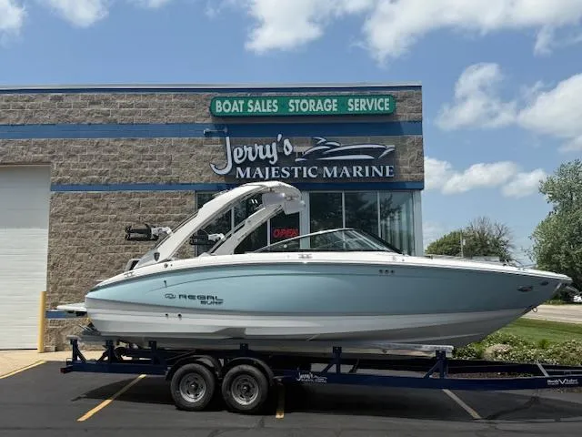 Slide: The Image of 2025 Regal LS6 Surf boat on trailer at Jerry's Majestic Marine dealership. - 1