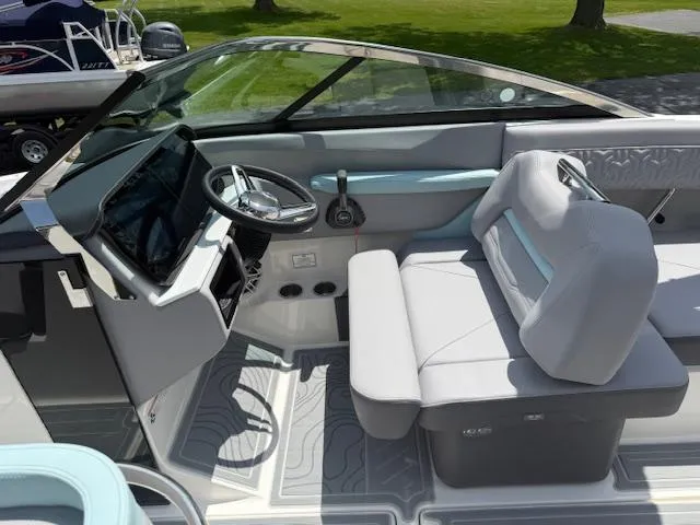 Slide: The Image of 2025 Regal LS6 Surf boat interior with modern dashboard and comfortable seating. - 10