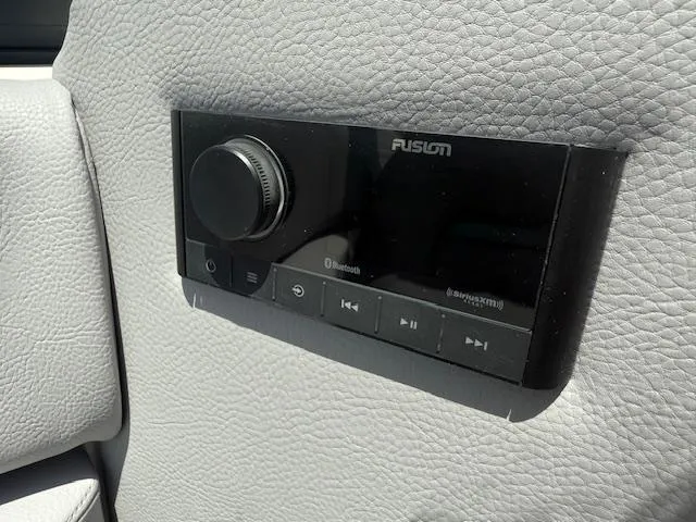 Slide: The Image of Control panel on 2025 Regal LS6 Surf boat with Fusion audio system. - 13