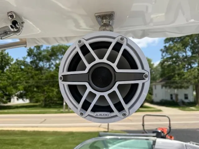 Slide: The Image of Speaker on 2025 Regal LS6 Surf boat, featuring JL Audio, outdoors. - 23