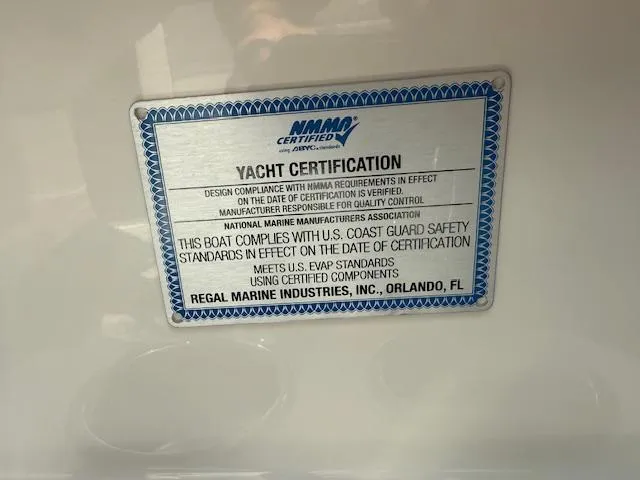 Slide: The Image of Yacht certification plaque for 2025 Regal LS6 Surf, NMMA certified, U.S. Coast Guard compliant. - 27
