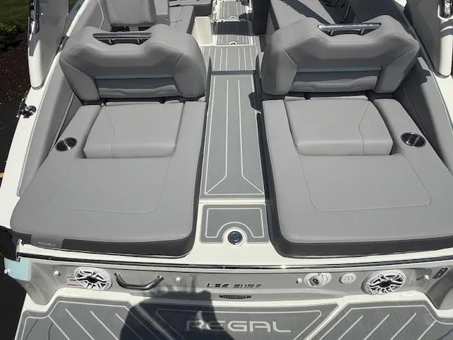 Slide: The Image of 2025 Regal LS6 Surf boat with sleek gray seating and modern design. - 30