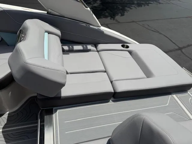 Slide: The Image of 2025 Regal LS6 Surf boat with luxurious gray seating and sleek design. - 31