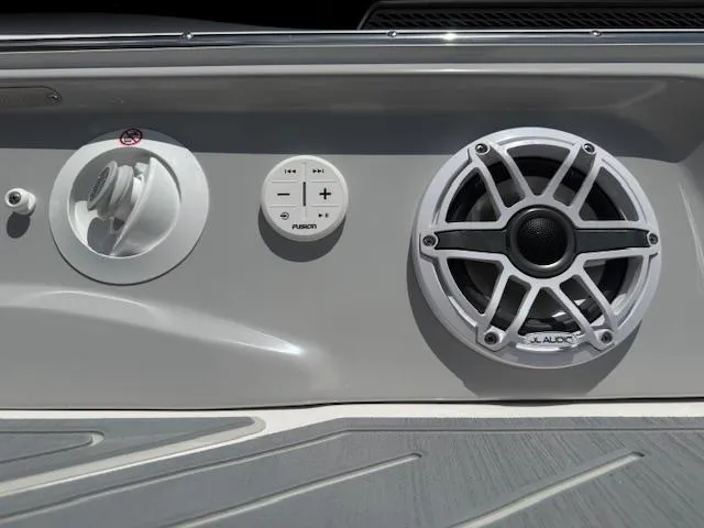 Slide: The Image of 2025 Regal LS6 Surf boat audio controls and speaker system. - 32
