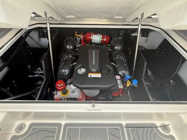 Slide: The Image of Engine compartment of 2025 Regal LS6 Surf boat, featuring a well-organized layout and fire extinguisher. - 33