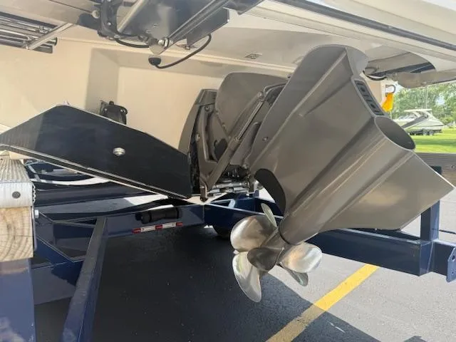 Slide: The Image of 2025 Regal LS6 Surf boat propeller and hull on trailer, showcasing sleek design. - 6