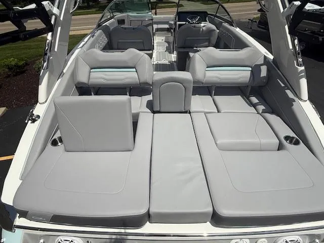 Slide: The Image of 2025 Regal LS6 Surf boat interior with luxurious gray seating and modern design. - 7