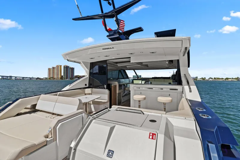 Slide: The Image of 2025 Formula 500 Super Sport Crossover yacht with spacious deck and luxurious seating. - 11