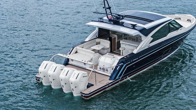 Slide: The Image of 2025 Formula 500 Super Sport Crossover luxury boat on water, featuring multiple outboard engines. - 14