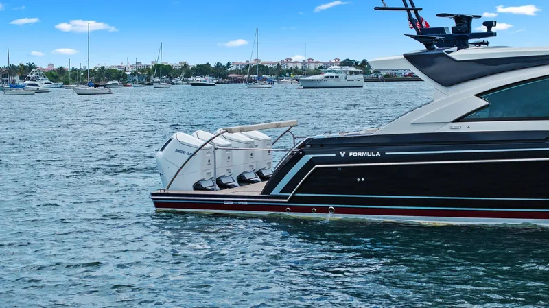 Slide: The Image of 2025 Formula 500 Super Sport Crossover yacht on water, showcasing sleek design and powerful engines. - 16