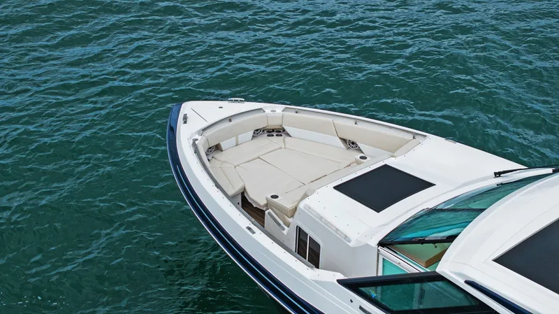 Slide: The Image of 2025 Formula 500 Super Sport Crossover boat on water, featuring spacious seating and sleek design. - 18