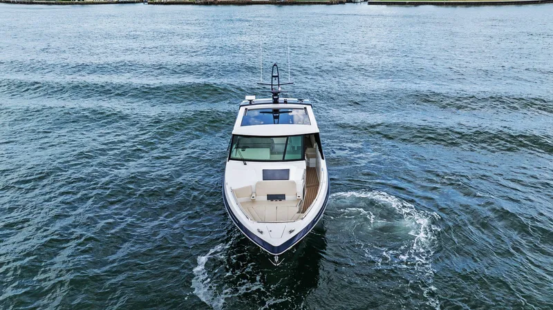 Slide: The Image of 2025 Formula 500 Super Sport Crossover yacht cruising on open water. - 4